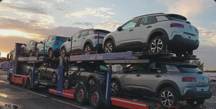 Car hauler transporting several vehicles